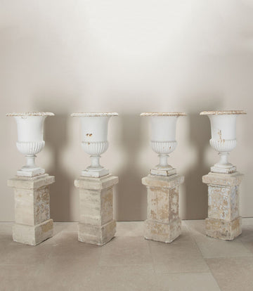 Set of Four 19th Century French Cast Iron Urns on 19th C Stone Plinths
