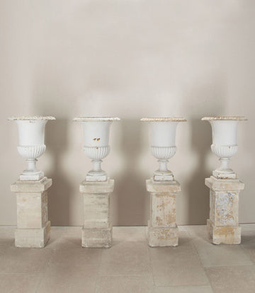 Set of Four 19th Century French Cast Iron Urns on 19th C Stone Plinths